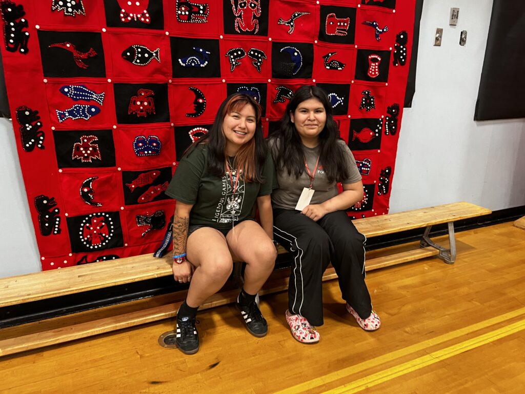 two volunteers (grade 11) smiling to the camera