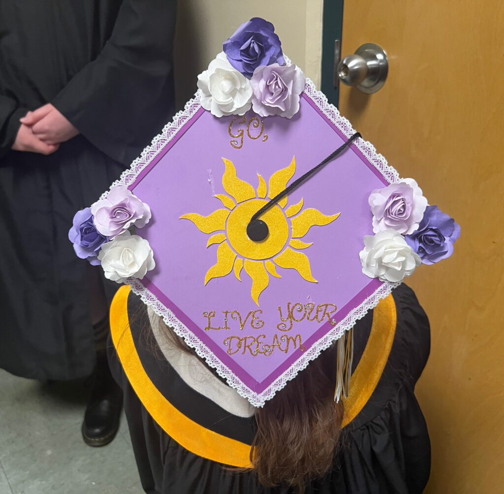 Cedar grads cap decorated "Go, live your dream"