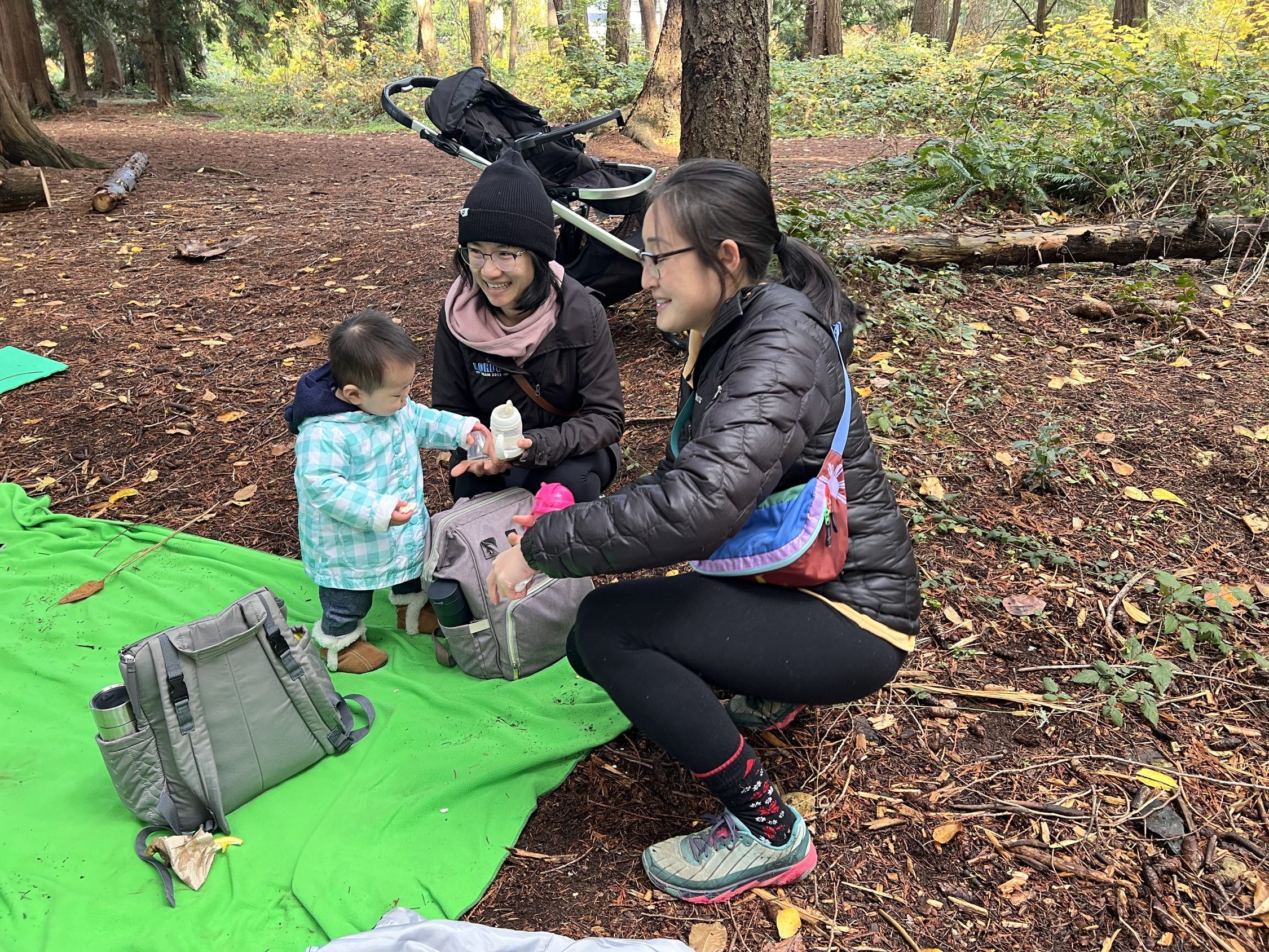 Family members in the forest with their young child