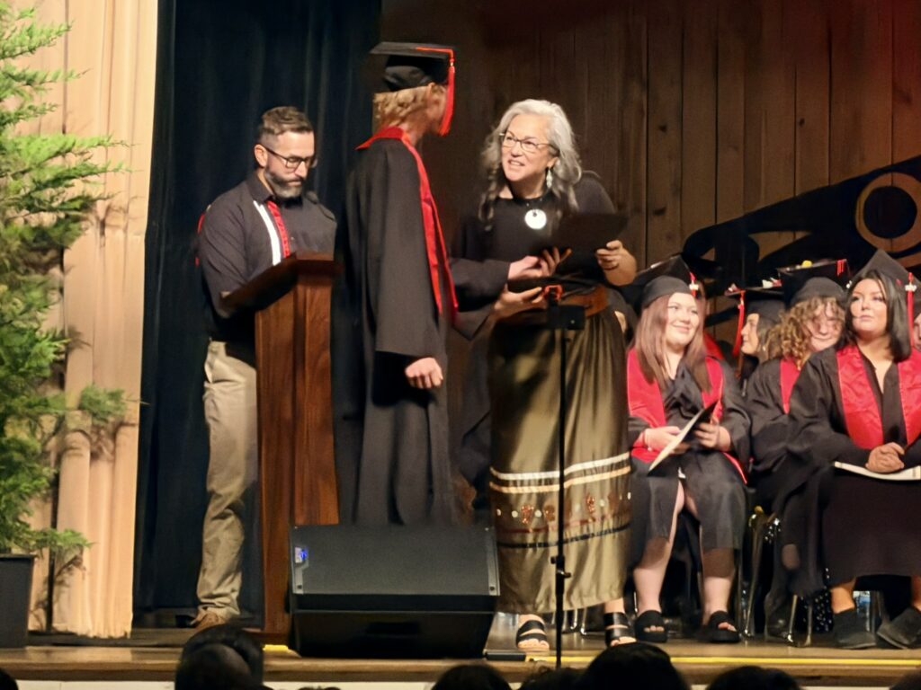 Learning Alternatives graduation ceremony - student walks across stage
