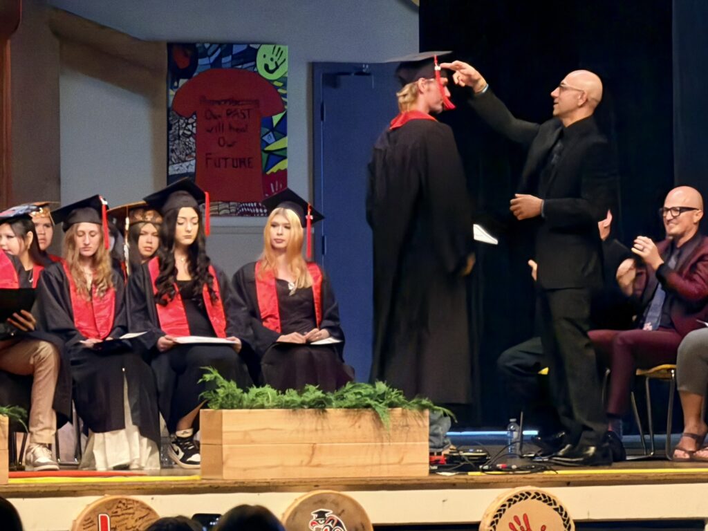 Learning Alternatives graduation ceremony - student walks across stage