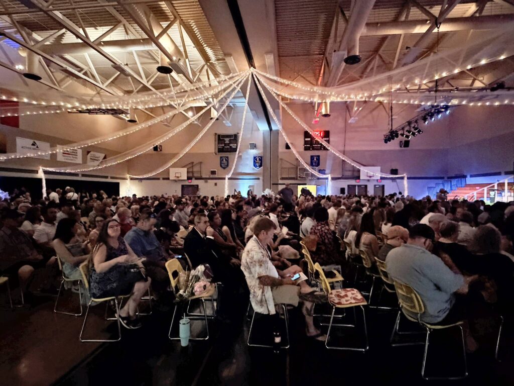 image of the ceremony gym decorated with dim warm lighting