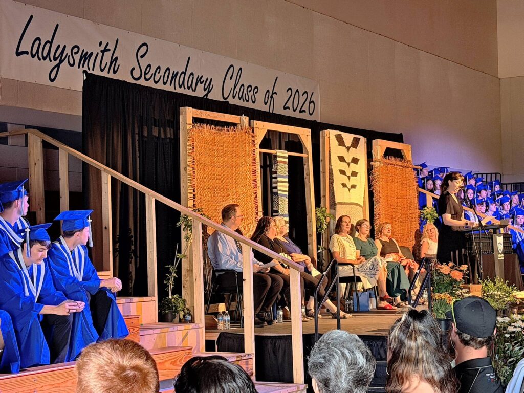 "Ladysmith Secondary Class of 2026" banner in backdrop of stage