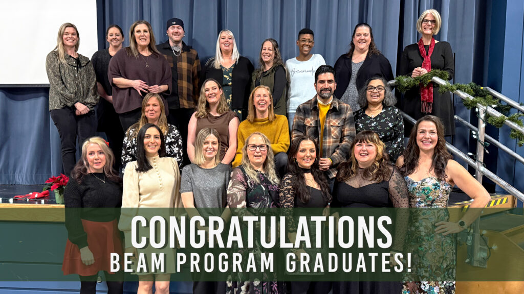 BEAM program graduates smile in a group photo